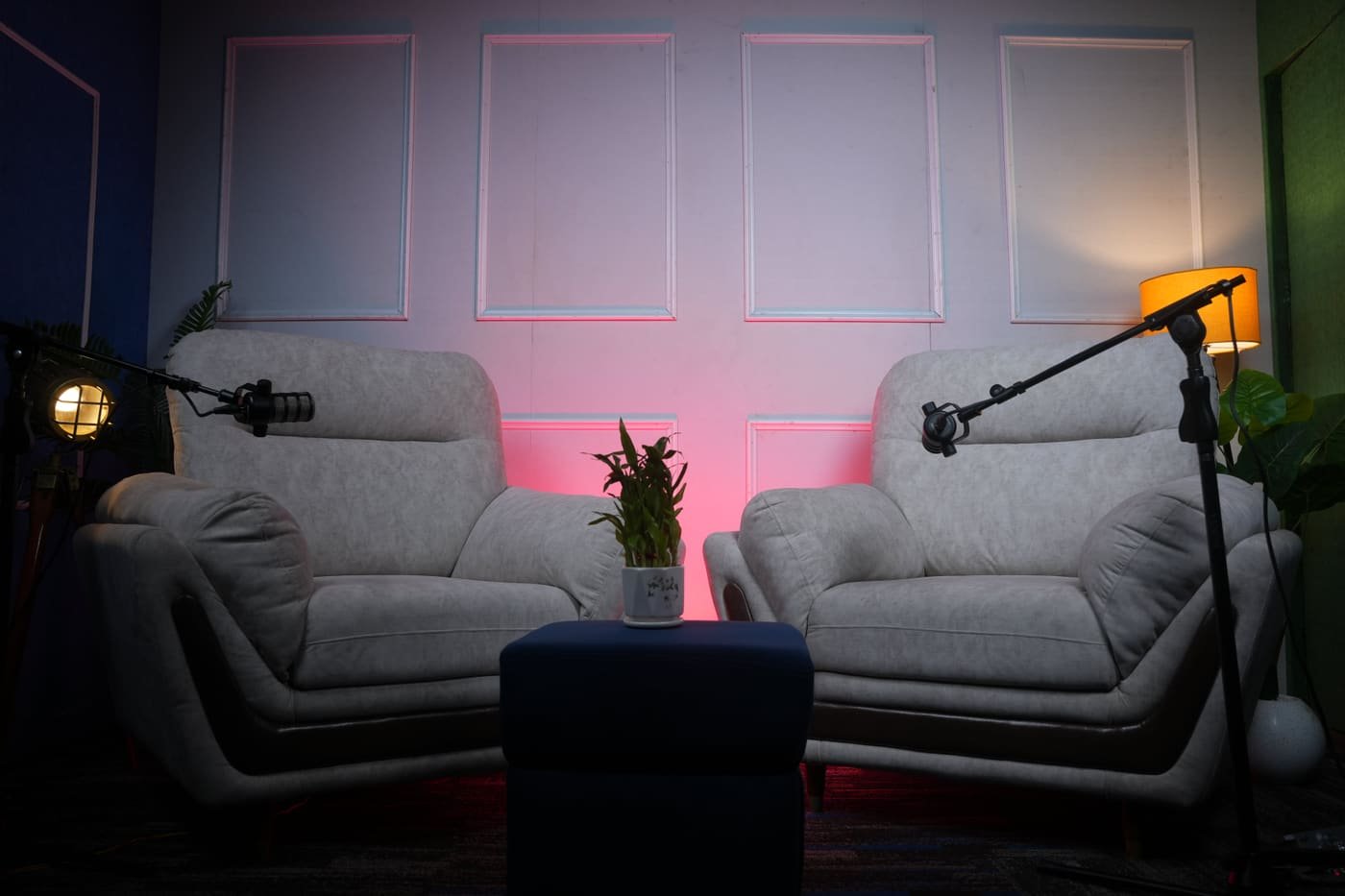 Podcast set with a white panelled wall